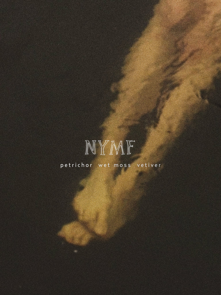 Text 'NYMF' with 'petrichor wet moss vetiver' on a dark background